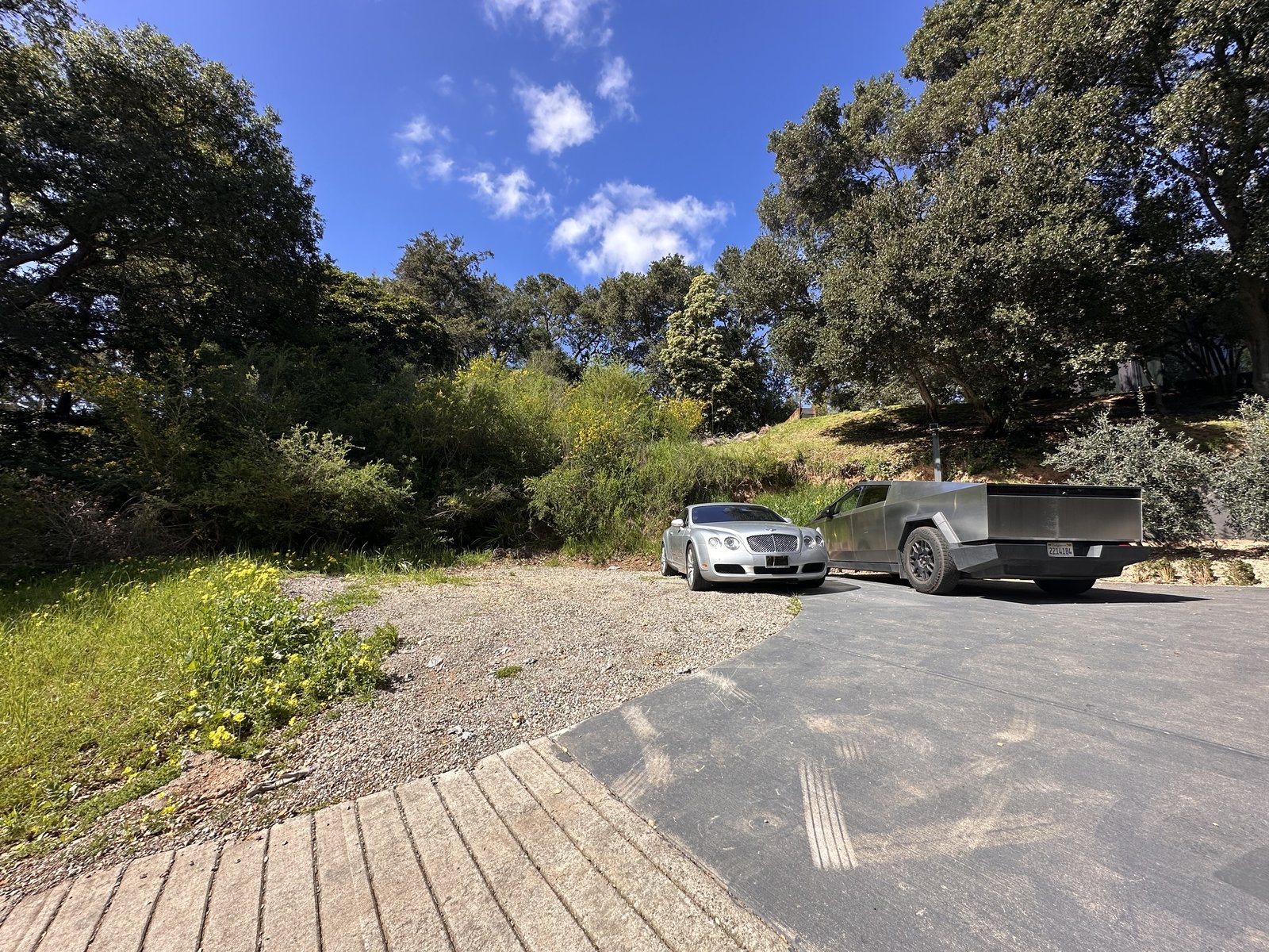 0 Frye Street lot — flat building pad with mature oak trees and green hillside in Oakland Hills